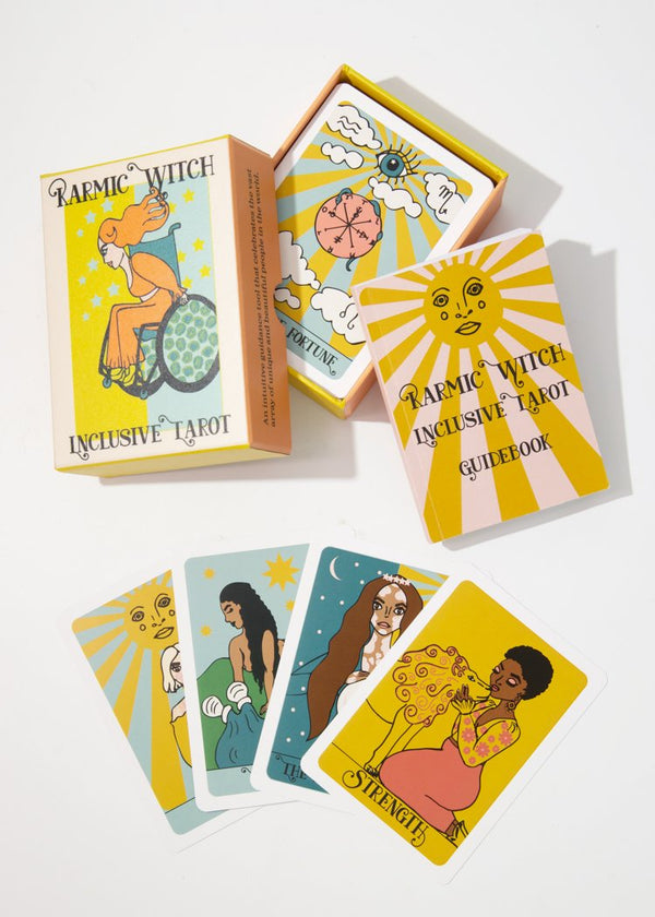 Karmic Witch inclusive tarot deck. Box, and guidebook with spread of The Sun, The Star, The High Preistess, and Strength Cards